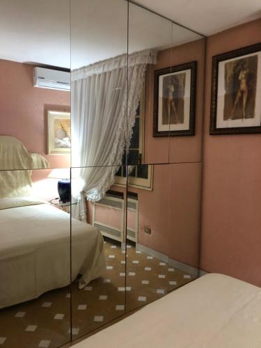 Ένα ή περισσότερα κρεβάτια σε δωμάτιο στο La Barca sul Mare