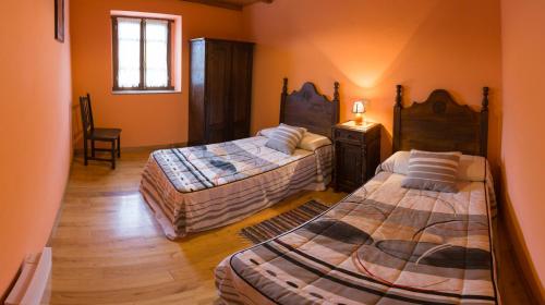 سرير أو أسرّة في غرفة في Casa Aniceto