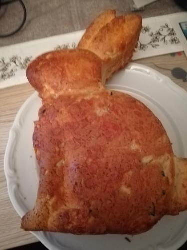 a white plate with a piece of food on it at Pension Achteridyll in Ueckeritz