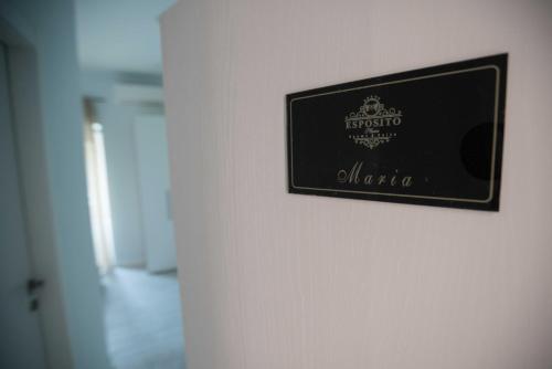 a picture of a sign on a wall at ESPOSITO PLAZA- ROOMS & SUITE in Naples