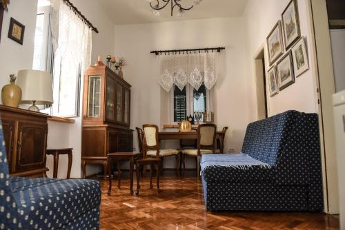 a living room with a table and chairs at Apartment Miguel in Kotor