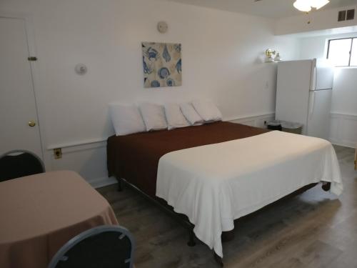 Ένα ή περισσότερα κρεβάτια σε δωμάτιο στο Nautical Beach Properties