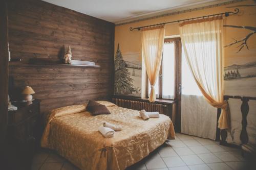 Кровать или кровати в номере Ristorante Residence Giardini