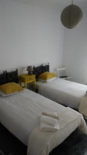 Postel nebo postele na pokoji v ubytování Vasco Santana Guesthouse