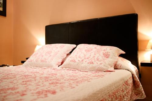Un ou plusieurs lits dans un hébergement de l'établissement Hotel Victor Hugo Nice