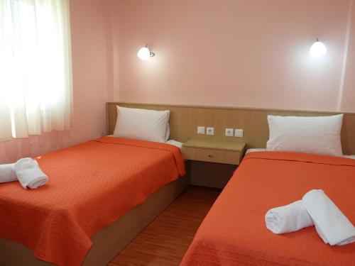 Кровать или кровати в номере Apartment Christos Limenaria
