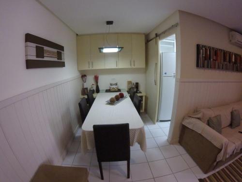 a living room with a table and a couch at Apartment Neo 2.0 in Maceió