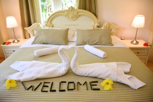 Ένα ή περισσότερα κρεβάτια σε δωμάτιο στο Jessies Guest House Seychelles