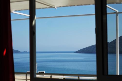 a view of the ocean from a window at JK apartmani in Herceg-Novi