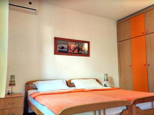 Ένα ή περισσότερα κρεβάτια σε δωμάτιο στο Apartments Maris Garden