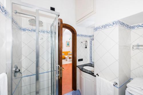 a bathroom with a shower and a toilet at Casa Chiesa Nuova in Positano