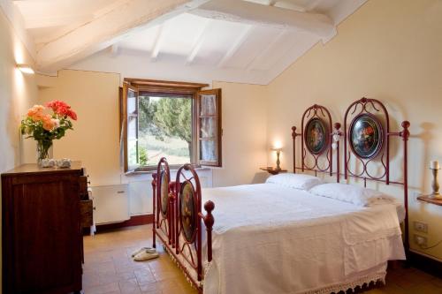 Ein Bett oder Betten in einem Zimmer der Unterkunft Poderi Arcangelo