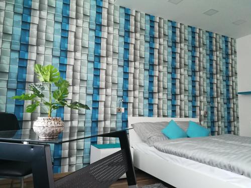 a living room with a couch and a table at Class Apartment in Szeged