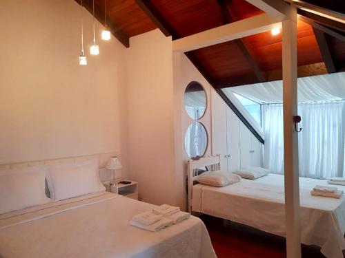 Una cama o camas en una habitación de Pousada Harmonia Pomerana