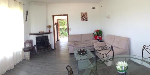 a living room with a couch and a fireplace at La Vençoise in Vence