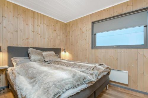 Ένα ή περισσότερα κρεβάτια σε δωμάτιο στο Luksushytte i Kokelv