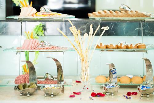 a buffet of food and pastries on a table at Royale Signature Hotel in Alor Setar