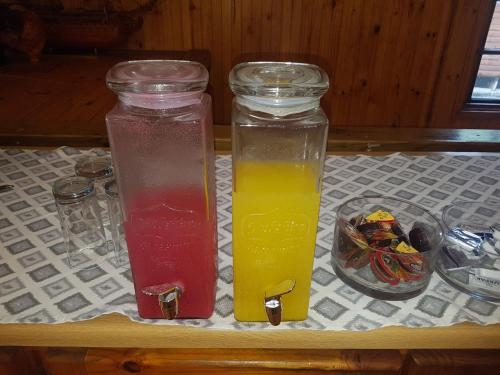 two bottles of juice sitting on a table at The Spotted Grunter Resort in Port St Johns