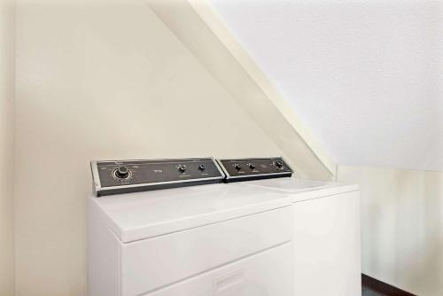 a white washer and dryer in a room at Super 8 by Wyndham Eureka/Six Flags Nearby in Eureka