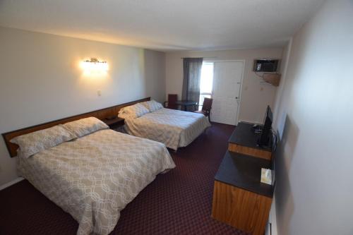 Postel nebo postele na pokoji v ubytování Airways Motel