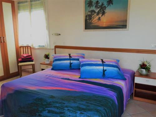Una cama o camas en una habitación de Residence Onda Blu