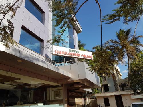 a building with a sign on the side of it at Hotel Subhalakshmi Palace in Kāraikkudi