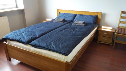 Een bed of bedden in een kamer bij Villa u Przyjaciół