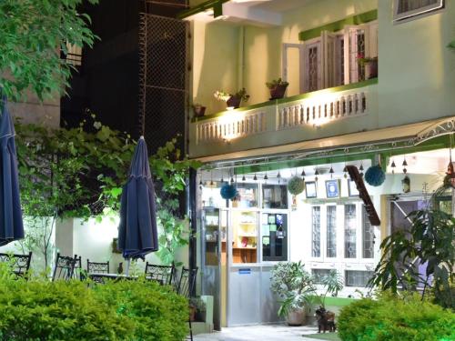 a restaurant with a balcony and a patio at Shakya House in Pātan