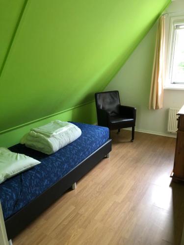 Postel nebo postele na pokoji v ubytování 't Hulzen 55 or 61 Winterswijk