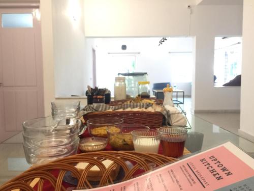 a table with a basket of food on a counter at Locul Uptown - Near Bangalore Palace Grounds in Bengaluru