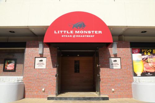 a building with a red sign that reads little monster brewery at Osaka Tokyu REI Hotel in Osaka