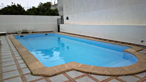 a large swimming pool on top of a building at Santa Luzia Dream in Santa Luzia