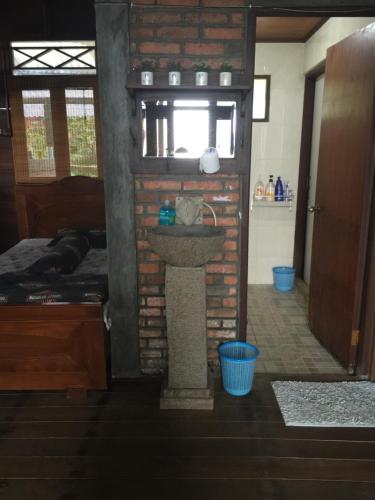 a bathroom with a sink in the middle of a room at Villa Diantie in Bogor
