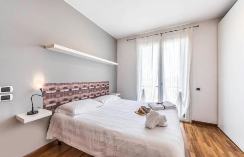 Een bed of bedden in een kamer bij Novalesi Apartment