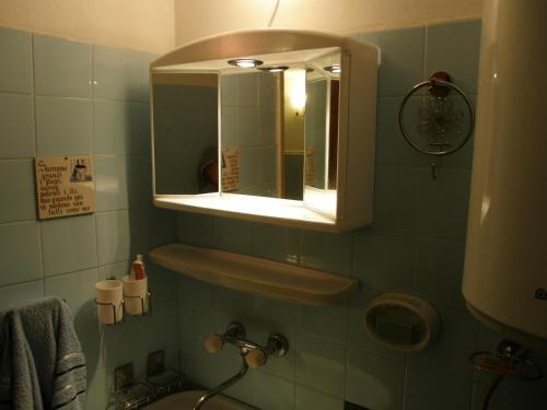 a bathroom with a sink and a mirror at Stone House in Buljarica in Petrovac na Moru