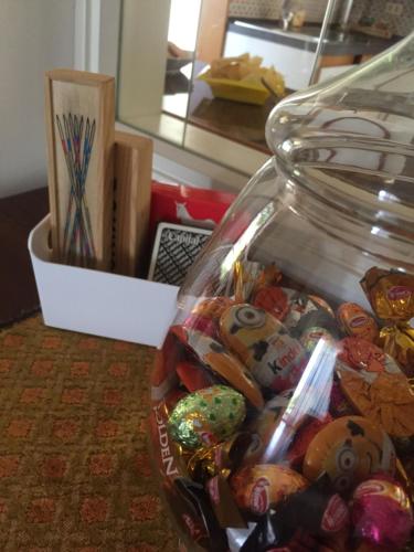 a glass jar filled with different types of candy at Villa Elena in Manerba del Garda