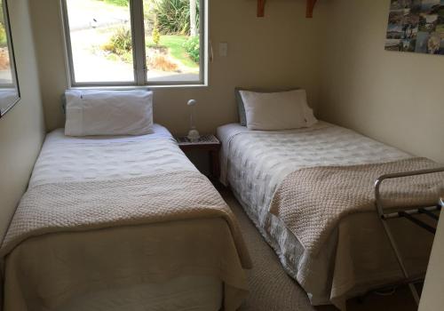 Ліжко або ліжка в номері Waimarie
