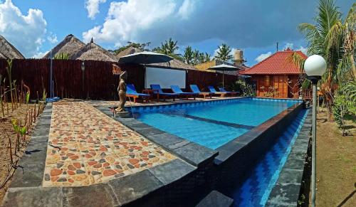 Bazén v ubytování Lembongan Tropical Guesthouse nebo v jeho okolí