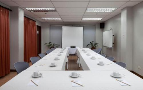 a large conference room with a long table and chairs at Microtel by Wyndham Baguio in Baguio