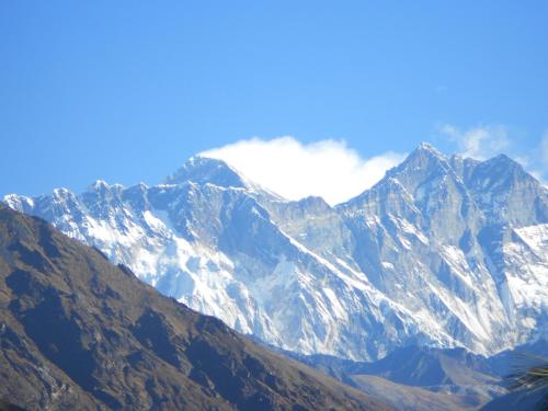a mountain range with snow on the top of it at The North Face Inn in Pokhara