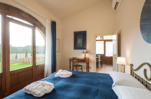 Ένα ή περισσότερα κρεβάτια σε δωμάτιο στο Villa Le Caggia