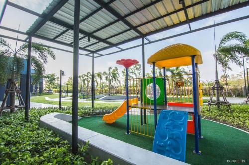 a playground with a slide in a park at Sea View Residence in Cha Am