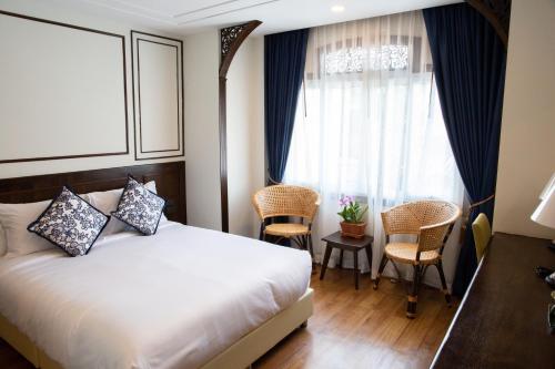 Giường trong phòng chung tại Elliebum Boutique Hotel