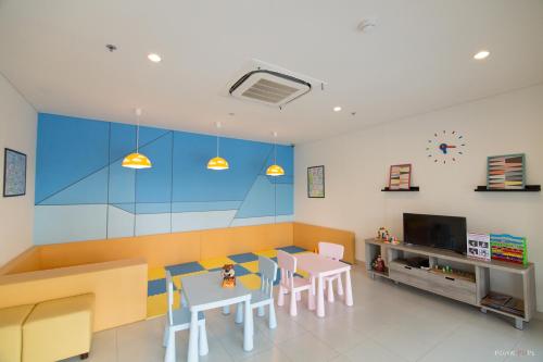 a dining room with a table and chairs at Sea View Residence in Cha Am