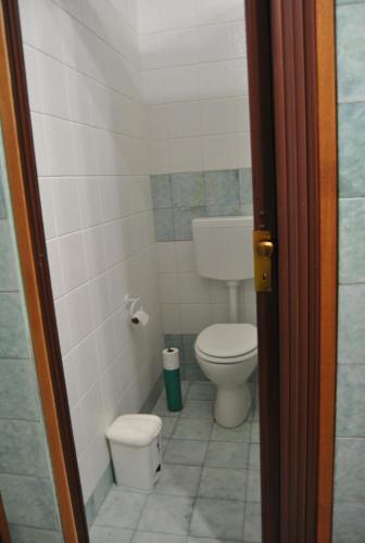 a small bathroom with a toilet and a sink at Balarm - Hostel and Bar in Palermo