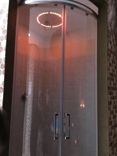 a shower with a glass door in a bathroom at Grand Hotel Stella Maris Italia in Palmi