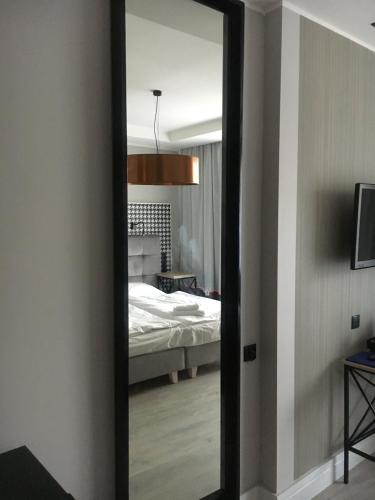 Letto o letti in una camera di Hotel Pomarańczowa Plaża