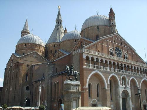 a large building with a statue in front of it at Residence Delta in Rovigo