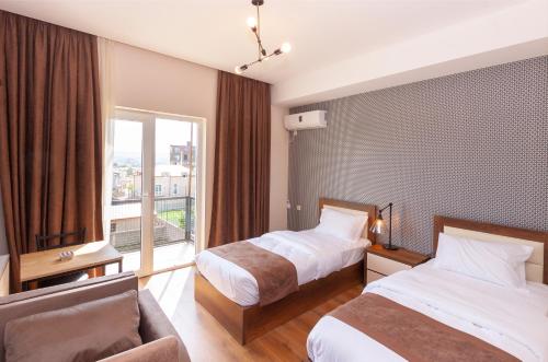 Postel nebo postele na pokoji v ubytování Hotel Amser