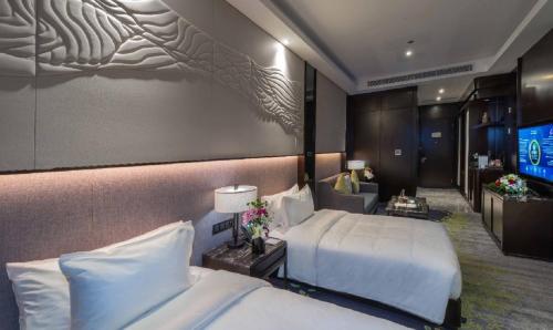 En eller flere senge i et værelse på Braira Al Dammam